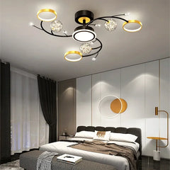 Black and gold modern ceiling fixture providing ambient glow