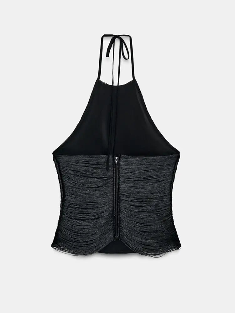 Detail-focused view of the rippled, tassel-like texture on a black halter tank top, showing light-catching surface and contouring.