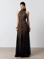 Close-up of the high neckline and lace texture across the bodice, showing the clean sleeveless cut and refined, sculpted shape.