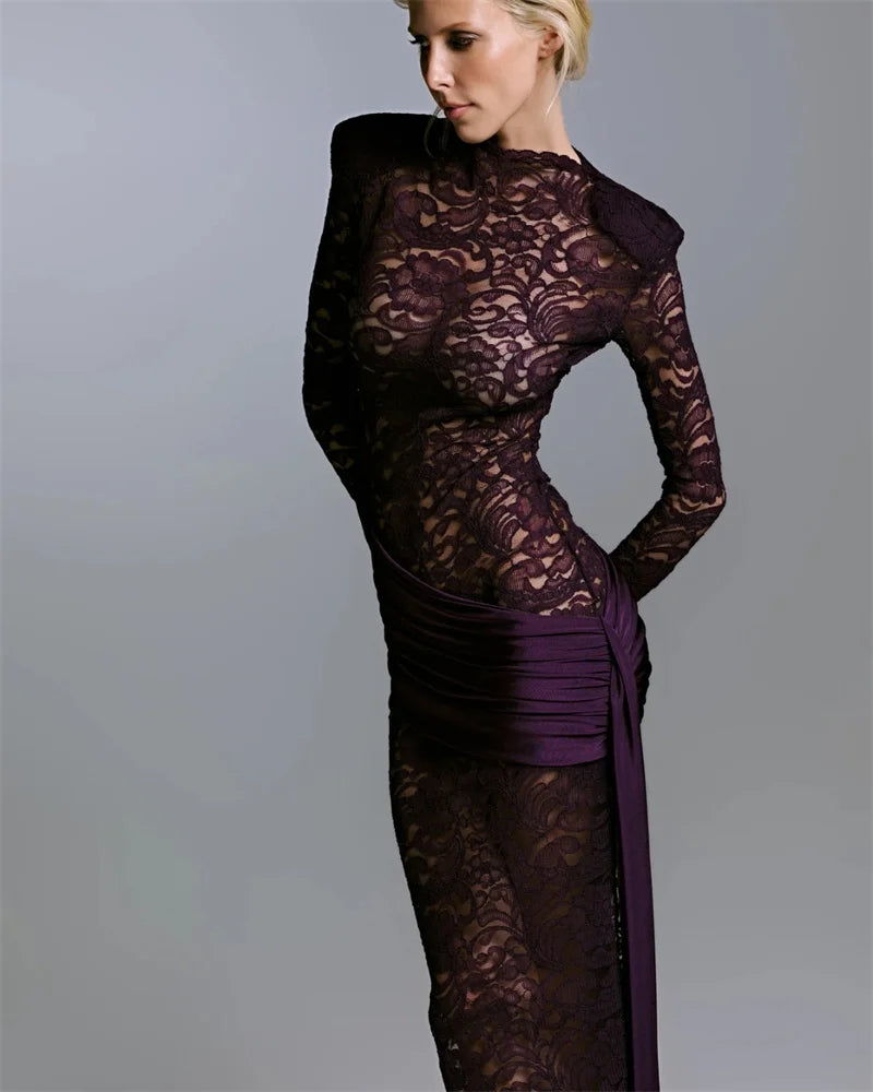Angled pose captures the dark lace maxi and deep plum drape accent, creating a refined after-dark look with elegant movement.