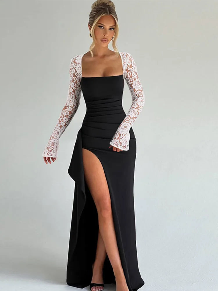 Model wearing a black maxi dress with sheer lace long sleeves and a high slit