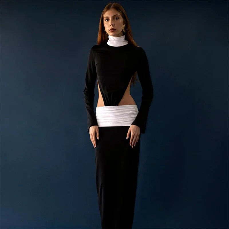 Full-length view showing the floor-skimming hem and sleek fit, with side waist cut-outs creating a sculpted silhouette.
