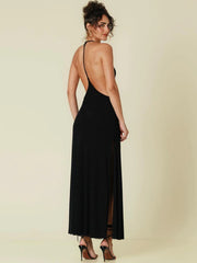 Black open-back halter maxi dress styled for summer night events