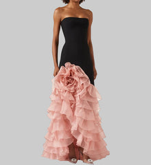 Dimensional floral appliqué accent with layered ruffles on a formal gown