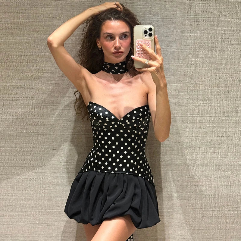 Black polka dot slash neck mini dress styled for playful party looks