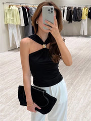 Mirror selfie of black halter knit crop top with wide-leg pants