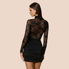 Back view of fitted sparkle mini dress with long sleeves