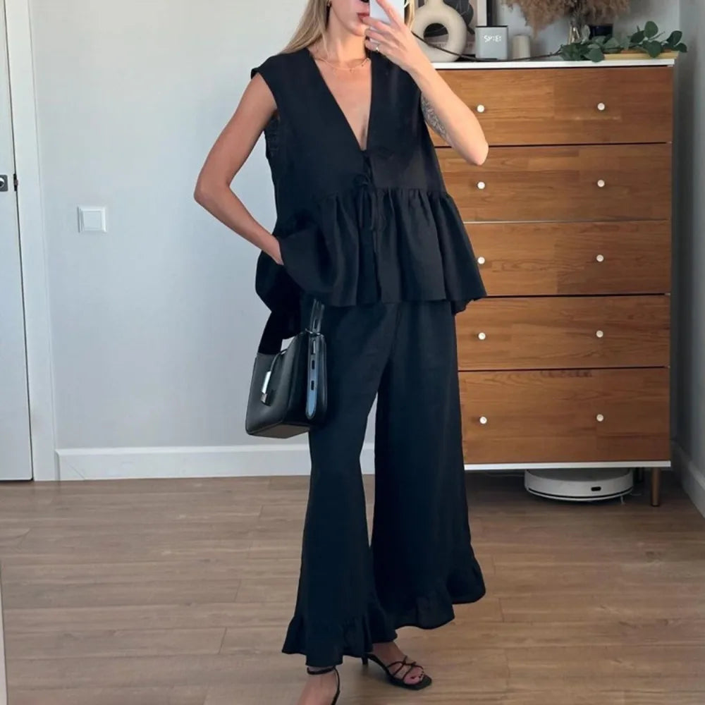 Black ruffle peplum two piece set styled for mirror selfie indoors