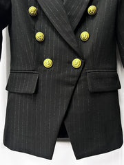 Two-piece black suit set displayed front-on, showcasing the sharp silhouette and refined tailoring details.