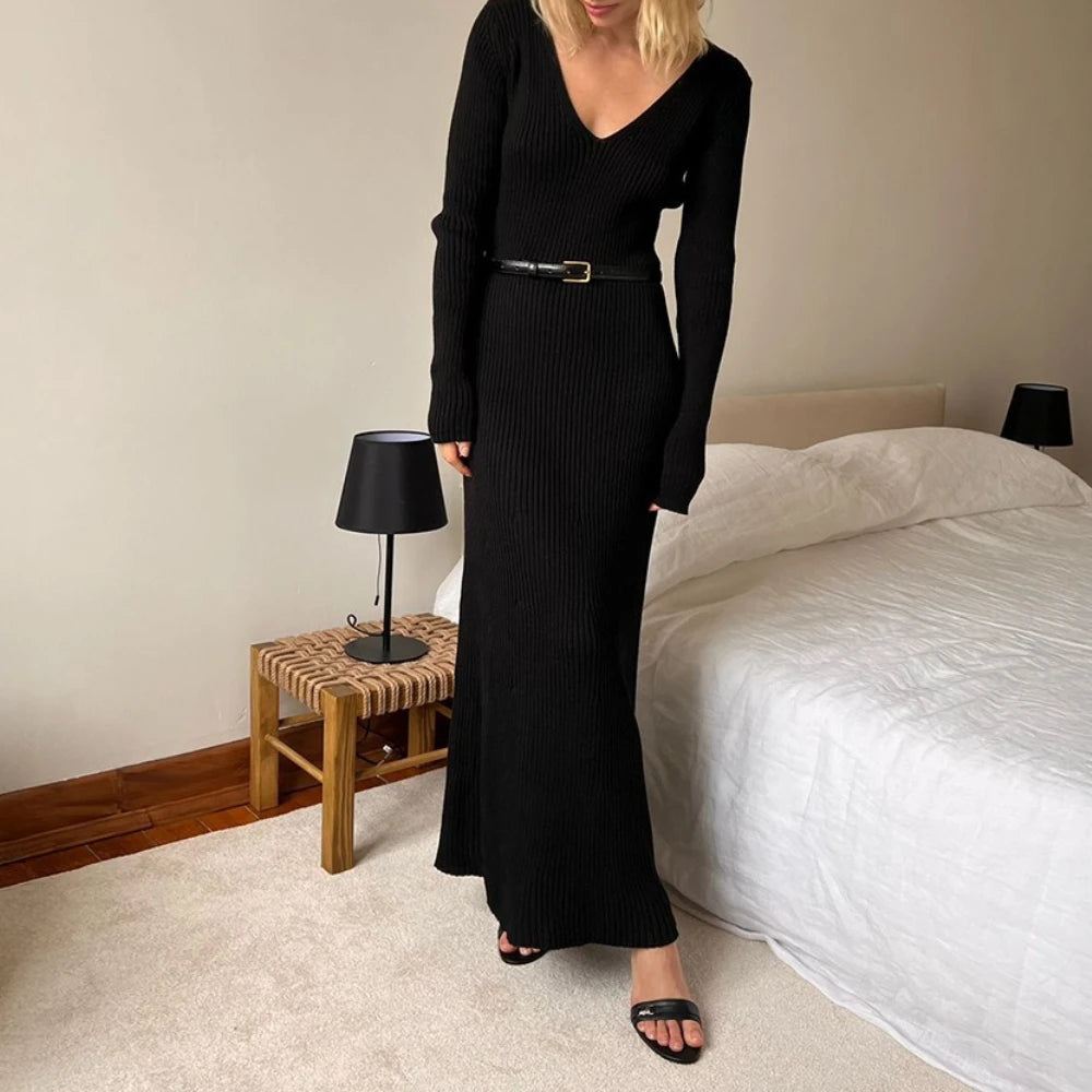 Black V-neck knit maxi dress styled for cozy autumn nights