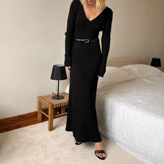 Black V-neck knit maxi dress styled for cozy autumn nights
