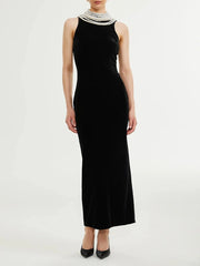 Black velvet maxi dress with draped pearl chain back detail
