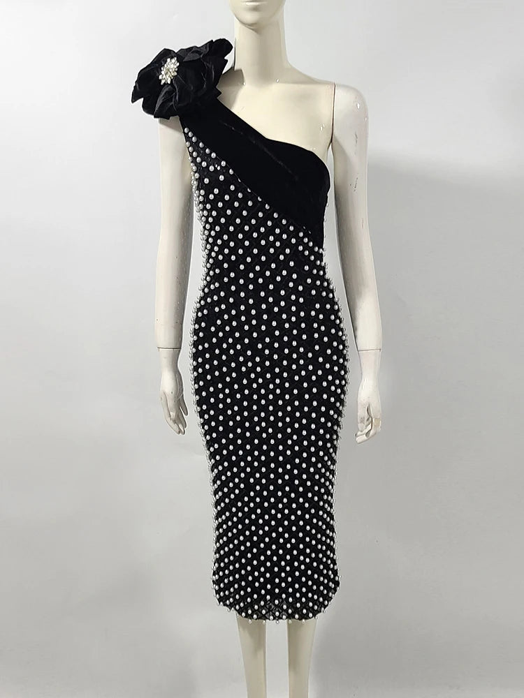 Black and white dot party midi gown styled for bold evening occasions