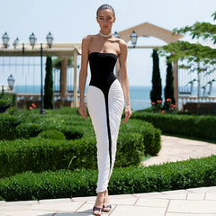 Black and white strapless maxi dress styled outdoors with greenery