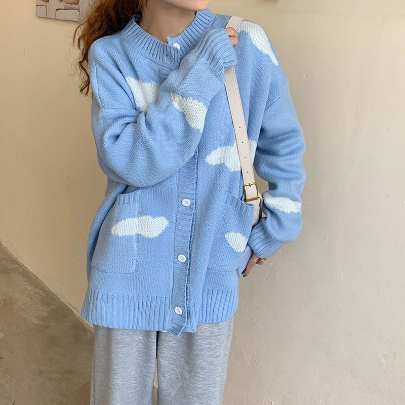 Blue knit cardigan with white cloud print and pockets
