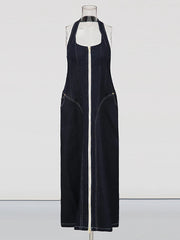 Blue denim halter dress showing sleek zip detail and long line
on a mannequin against a white background