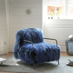 Blue faux fur lounge armchair with metal frame in minimalist room