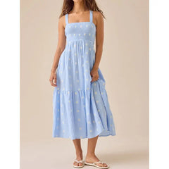 Blue floral embroidered midi dress styled for summer days