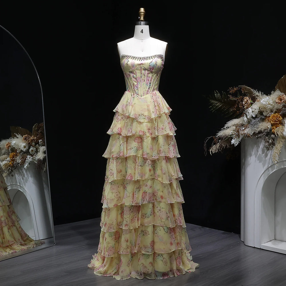 Floor-length A-line prom gown with boat neckline and tiered chiffon skirt