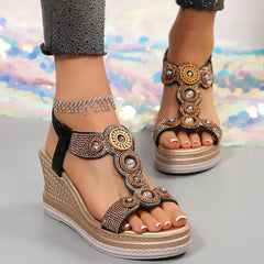 Front view of bohemian gold glitter wedge sandals for women