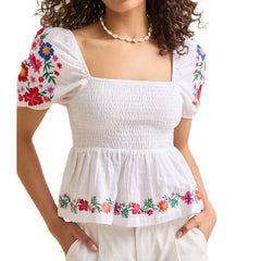 White blouse with casual peplum blouse styled for warm weather days on a white background