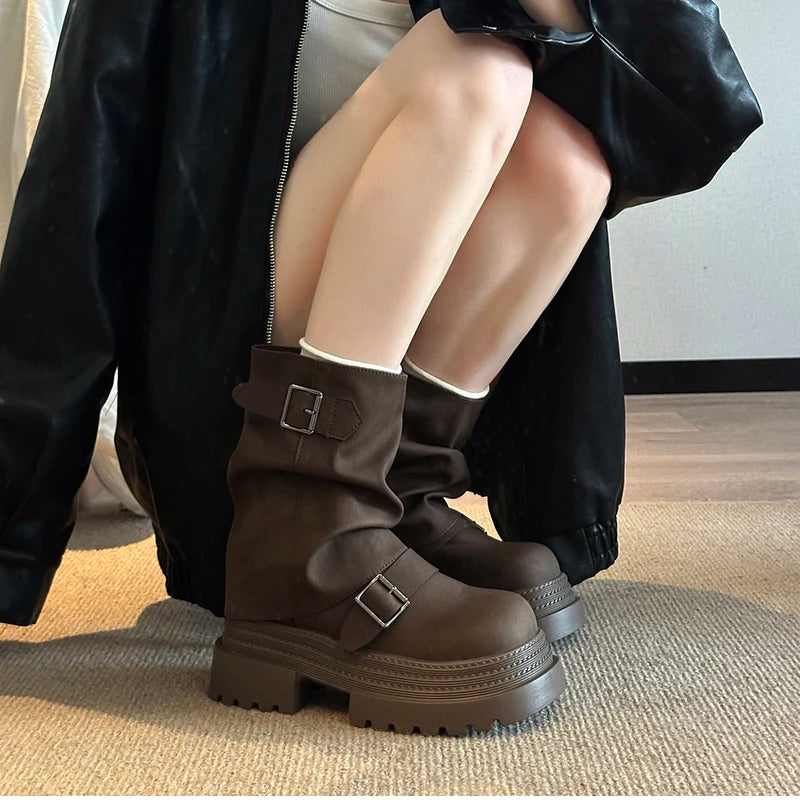Brown women’s platform buckle boots styled for winter wear
