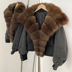 Close-up of the plush brown fur collar wrapping the neckline, showing dense texture and a smooth edge against the quilted body.