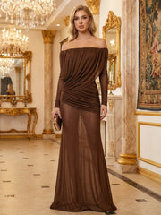 Model wearing a brown off-shoulder draped evening gown with long sleeves