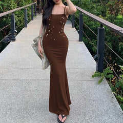 Brown spaghetti strap maxi dress styled for outdoor garden parties