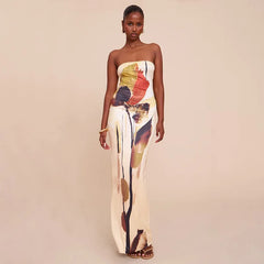 Woman wearing a brown and cream bodycon maxi dress against a beige background