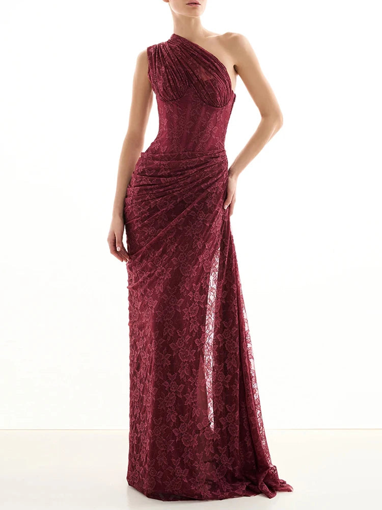 Lower-body detail showing the floor-length skirt and subtle slit, capturing the way the lace fabric falls and moves.