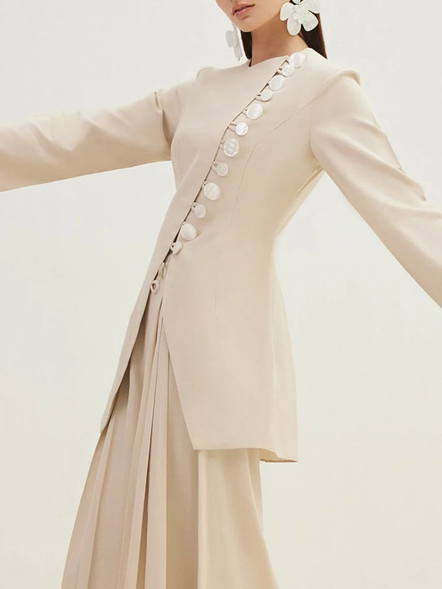 A close-up of the button closure detail on the jacket.