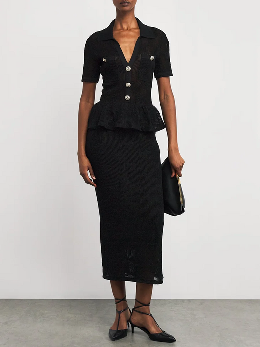 “Slim black dress styled for evening with ruffles and sheer panels”

