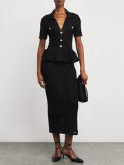 “Slim black dress styled for evening with ruffles and sheer panels”

