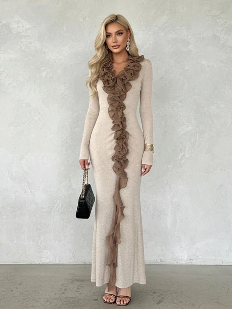 Close view highlighting layered ruffles and folded construction running through the center front