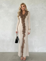 Close view highlighting layered ruffles and folded construction running through the center front