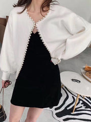 Elegant all-season sweater with pearl neckline