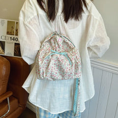 Versatile crossbody bag with soft bow accent