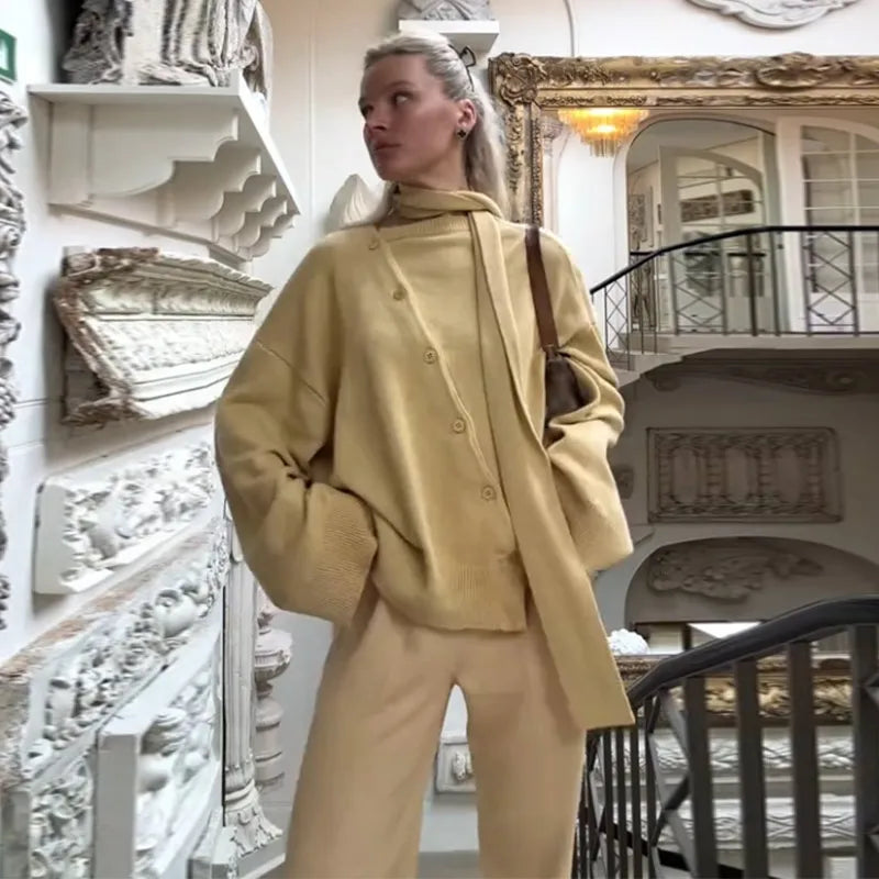 The loose fit of the knit top, highlighting its comfortable regular sleeves.