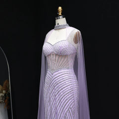 Champagne blue sweetheart mermaid dress styled for Dubai wedding galas, evening gown with intricate detailing on a mannequin against a black background