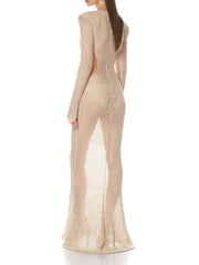 Close view of the openwork knit texture and bead-like embellishment on a champagne evening gown with a sleek, fitted line.