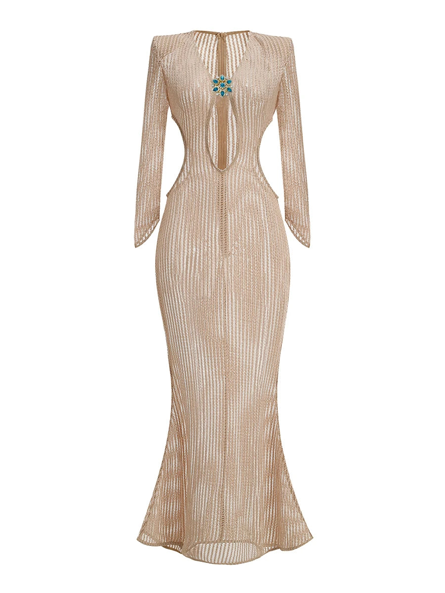 Floor-grazing hem and slim sheath silhouette of a champagne knit maxi dress, designed to fall straight and refined.