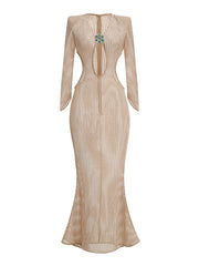 Floor-grazing hem and slim sheath silhouette of a champagne knit maxi dress, designed to fall straight and refined.