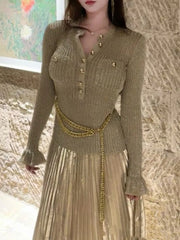 Round neck dress with fitted bodice and flowing pleated skirt