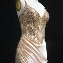 Sweep train detail on floor-length satin prom gown with fitted silhouette