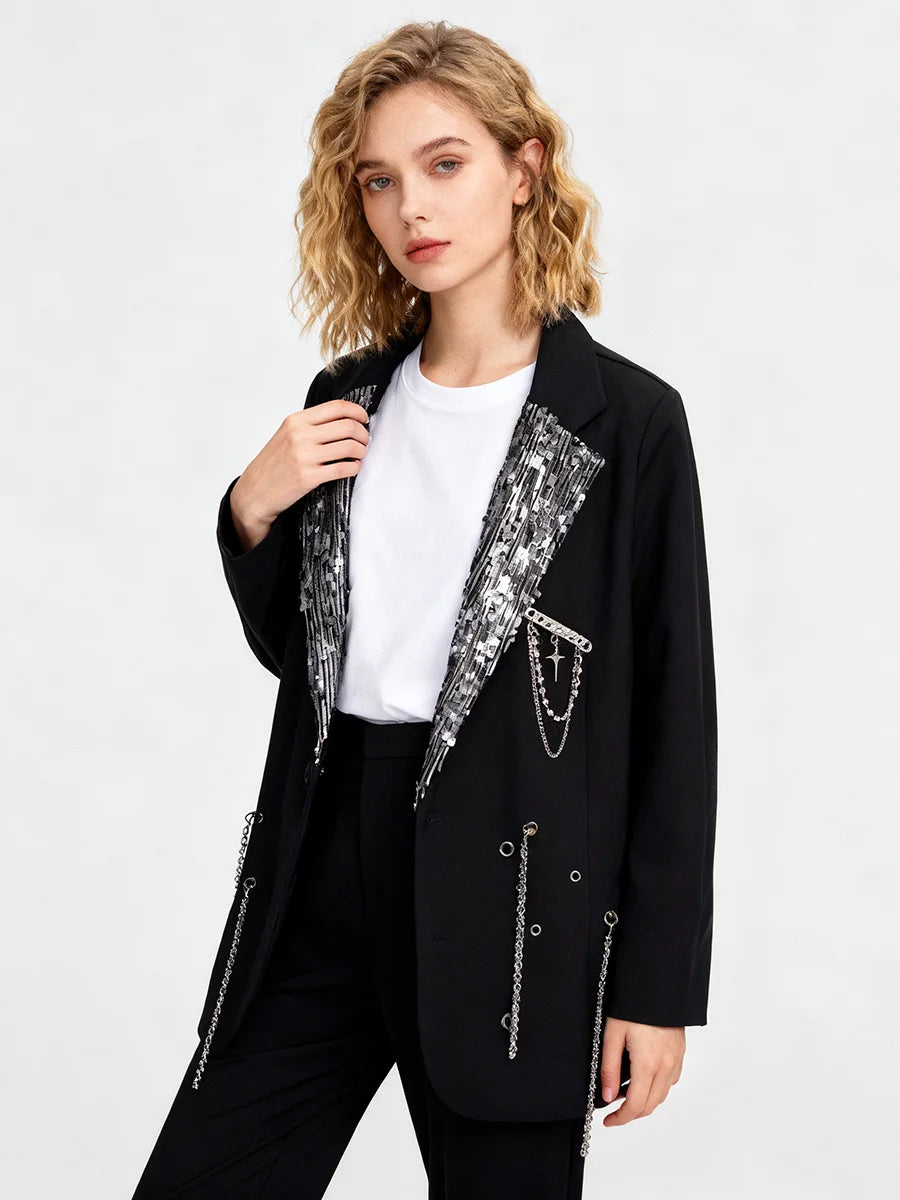 Black blazer with decorative charms and a notched sequin collar