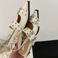 Close-up of chic white mules with low heel