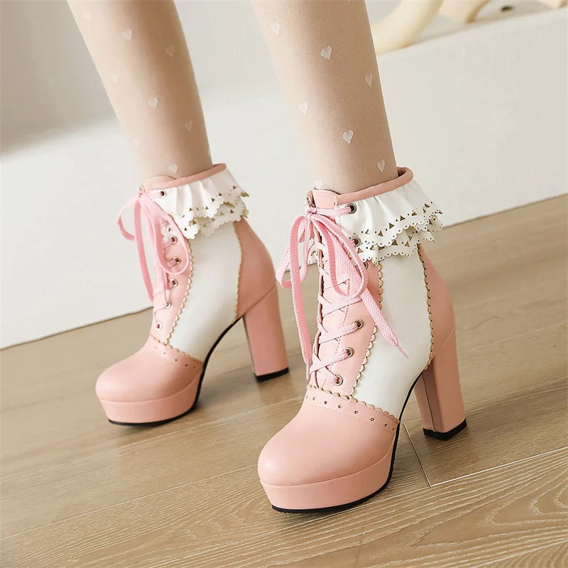 Round toe pink ankle boots with decorative ruffles