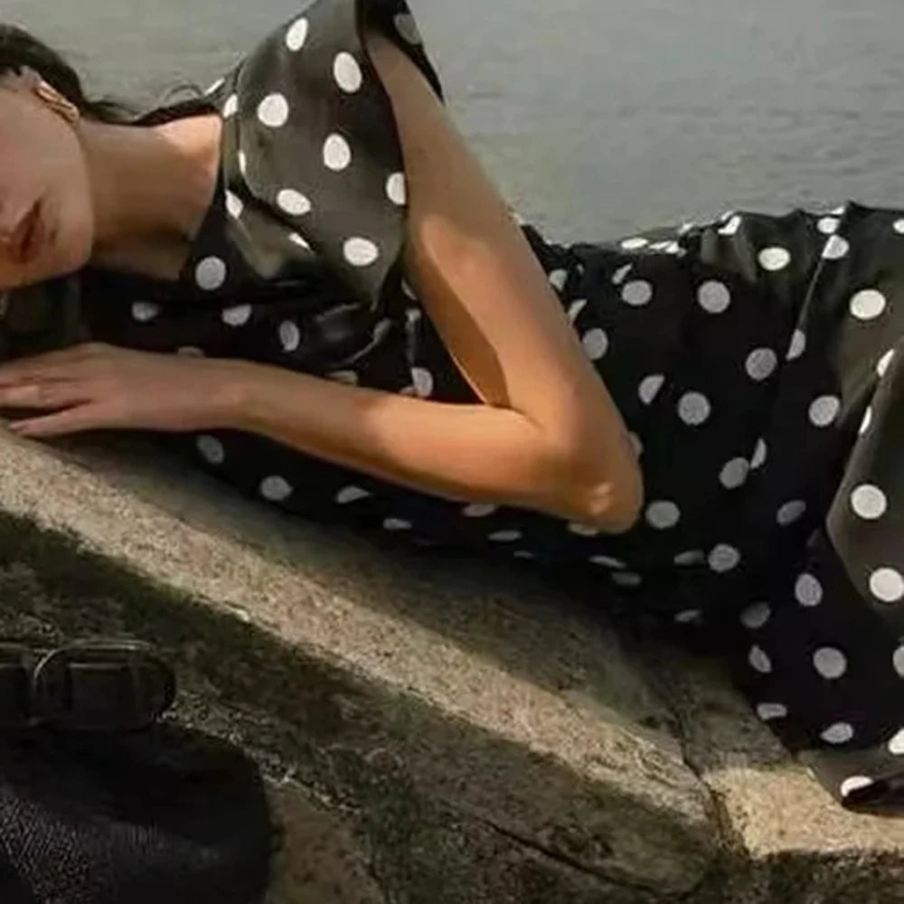 Classic black mini dress with playful vintage charm

