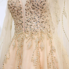 Close-up of the sweep train gold bridal party gown designed for formal celebrations